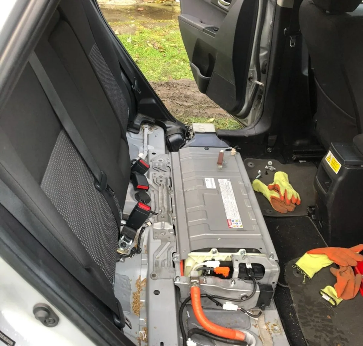 Hybrid battery pack accessed inside vehicle cabin